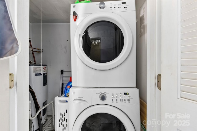 4605 Hedgemore Dr Unit I, Charlotte, NC 28209 - laundry room with laundry area, stacked washer / dryer, and electric water heater