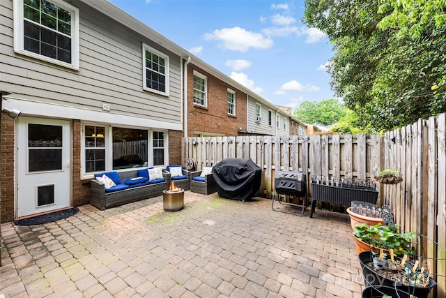 4605 Hedgemore Dr Unit I, Charlotte, NC 28209 - view of patio / terrace featuring grilling area, an outdoor hangout area, and fence