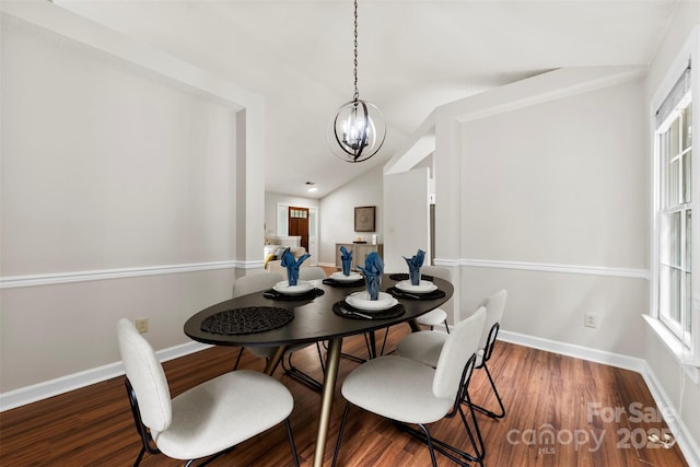13324 Kintyre Ct, Matthews, NC 28105 - dining area featuring a chandelier, wood finished floors, baseboards, and vaulted ceiling