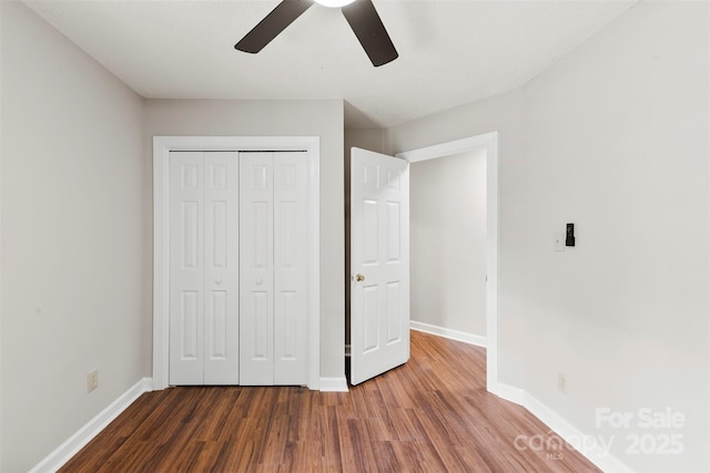 13324 Kintyre Ct, Matthews, NC 28105 - unfurnished bedroom with wood finished floors, baseboards, a closet, and ceiling fan