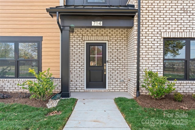 714 Falling Oak Aly Unit 18, Huntersville, NC 28078 - doorway to property with brick siding