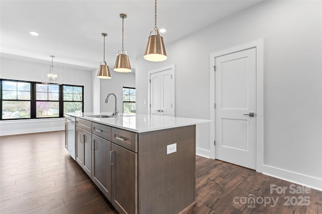 714 Falling Oak Aly Unit 18, Huntersville, NC 28078 - kitchen featuring a notable chandelier, a sink, dark wood-style floors, and light countertops