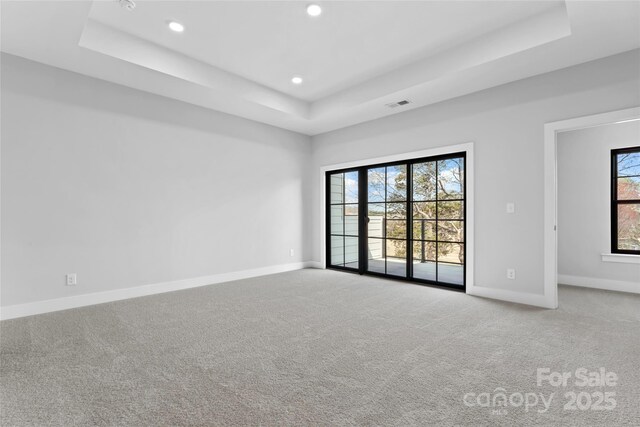 714 Falling Oak Aly Unit 18, Huntersville, NC 28078 - carpeted spare room featuring baseboards, visible vents, recessed lighting, and a raised ceiling