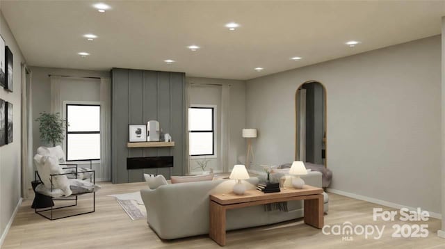 714 Falling Oak Aly Unit 18, Huntersville, NC 28078 - living room with light wood-style flooring, baseboards, arched walkways, and recessed lighting