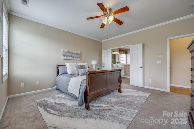 bedroom with crown molding, visible vents, baseboards, and carpet flooring