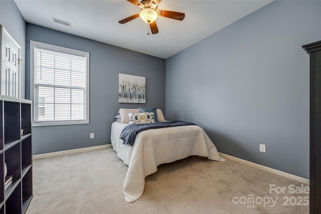 bedroom featuring visible vents, baseboards, carpet flooring, and ceiling fan