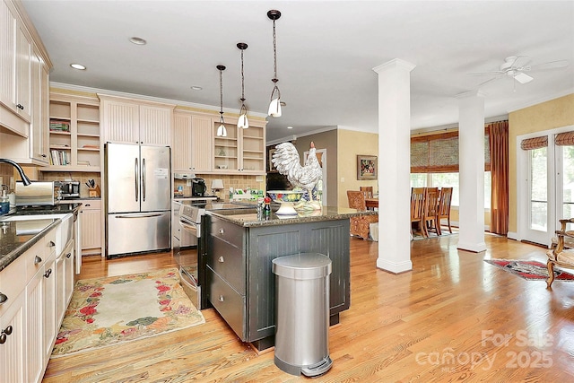 729 Lochaven Rd, Waxhaw, NC 28173 - kitchen featuring freestanding refrigerator, range with electric stovetop, open shelves, decorative columns, and a center island