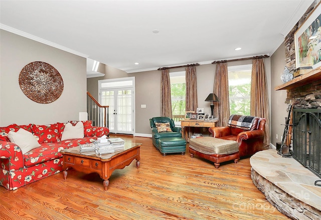 729 Lochaven Rd, Waxhaw, NC 28173 - living area with light wood-style flooring, a fireplace, stairway, ornamental molding, and recessed lighting