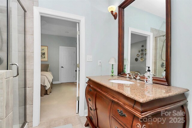 729 Lochaven Rd, Waxhaw, NC 28173 - bathroom featuring a stall shower, connected bathroom, vanity, and baseboards