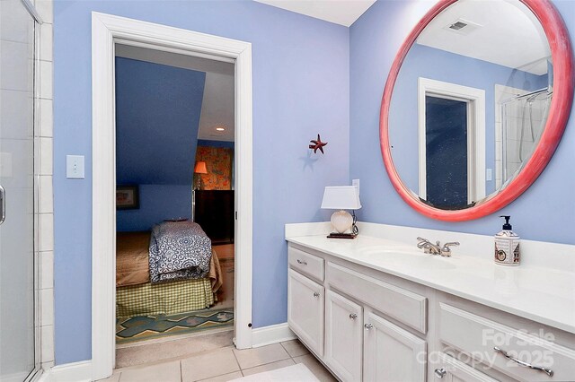 729 Lochaven Rd, Waxhaw, NC 28173 - ensuite bathroom with tile patterned flooring, vanity, an enclosed shower, and baseboards