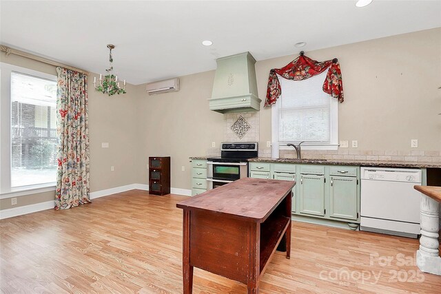 729 Lochaven Rd, Waxhaw, NC 28173 - kitchen featuring premium range hood, dishwasher, double oven range, plenty of natural light, and recessed lighting