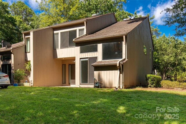 194 Riverview Ter, Clover, SC 29710 - rear view of property with a lawn, a chimney, and roof with shingles