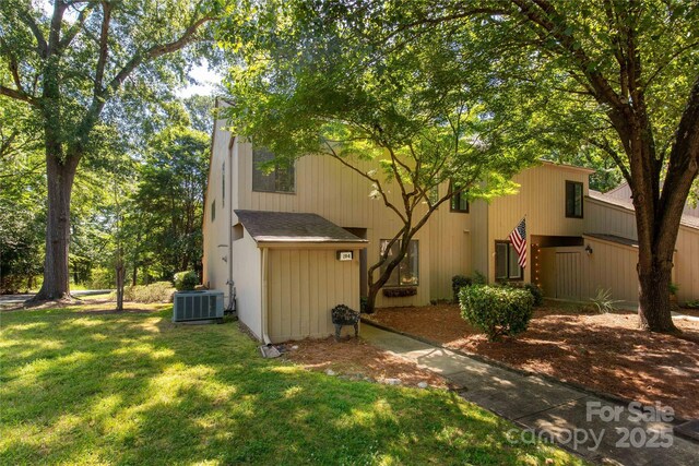 194 Riverview Ter, Clover, SC 29710 - back of house with a yard and roof with shingles