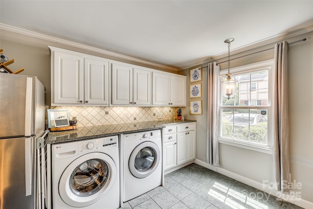 4607 Hedgemore Dr Unit H, Charlotte, NC 28209 - washroom featuring washing machine and dryer, baseboards, crown molding, laundry area, and light tile patterned floors