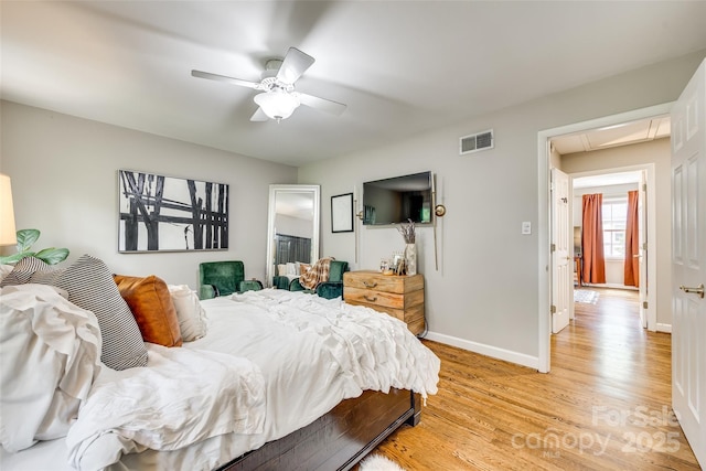 4607 Hedgemore Dr Unit H, Charlotte, NC 28209 - bedroom with a ceiling fan, attic access, light wood-type flooring, baseboards, and visible vents