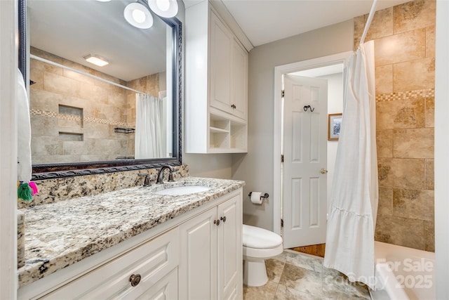 4607 Hedgemore Dr Unit H, Charlotte, NC 28209 - full bathroom featuring a tile shower, toilet, and vanity