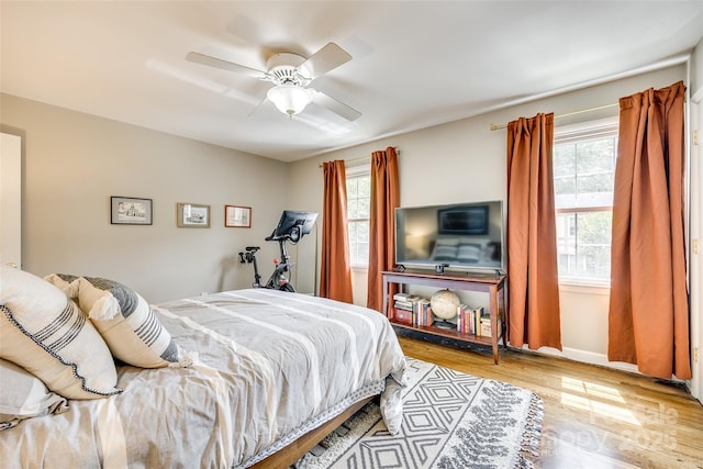 4607 Hedgemore Dr Unit H, Charlotte, NC 28209 - bedroom featuring wood finished floors, baseboards, and ceiling fan