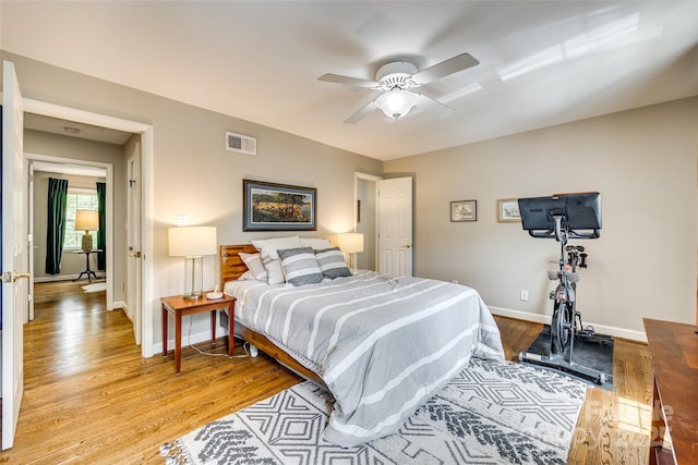 4607 Hedgemore Dr Unit H, Charlotte, NC 28209 - bedroom featuring visible vents, light wood finished floors, baseboards, and a ceiling fan
