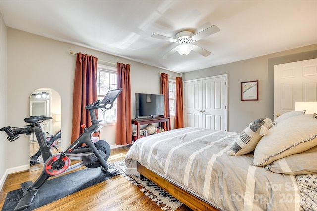 4607 Hedgemore Dr Unit H, Charlotte, NC 28209 - bedroom featuring baseboards, a ceiling fan, wood finished floors, and a closet