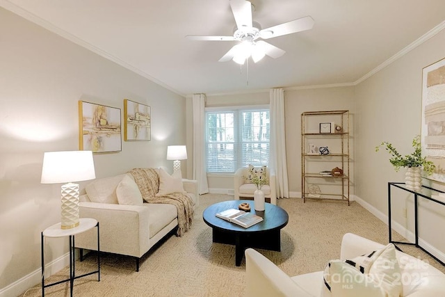 living room featuring ornamental molding, baseboards, light colored carpet, and ceiling fan
