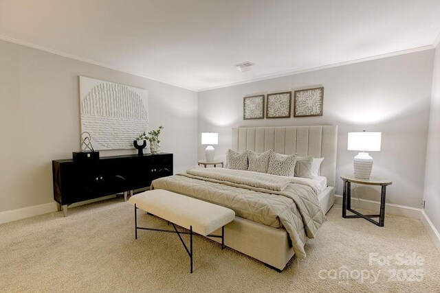 bedroom featuring light carpet, baseboards, and ornamental molding