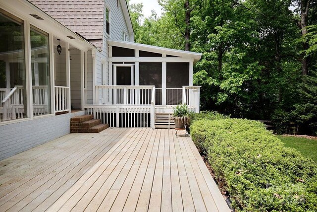 wooden terrace with a sunroom