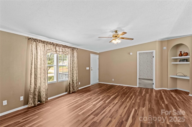 unfurnished living room with a ceiling fan, wood finished floors, and a textured ceiling
