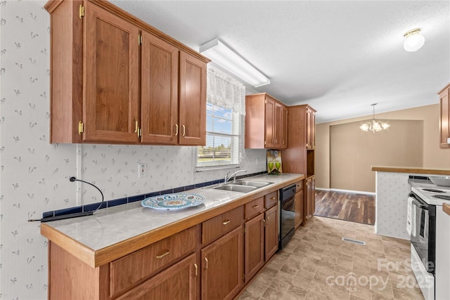 kitchen featuring a sink, dishwasher, white electric range, a notable chandelier, and visible vents
