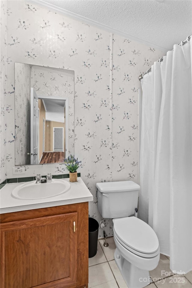 full bathroom with toilet, tile patterned floors, wallpapered walls, and a textured ceiling