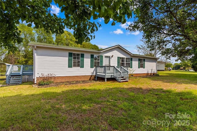 manufactured / mobile home with crawl space, a front yard, and a deck