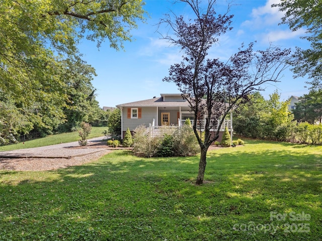 view of yard featuring covered porch
