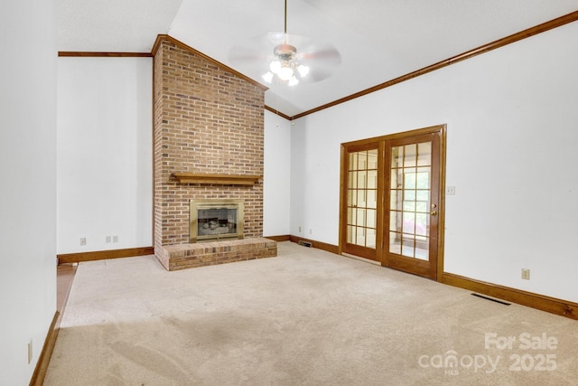 unfurnished living room featuring ceiling fan, carpet, ornamental molding, visible vents, and lofted ceiling