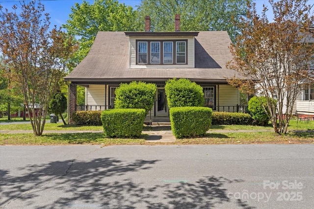 view of front of property featuring covered porch