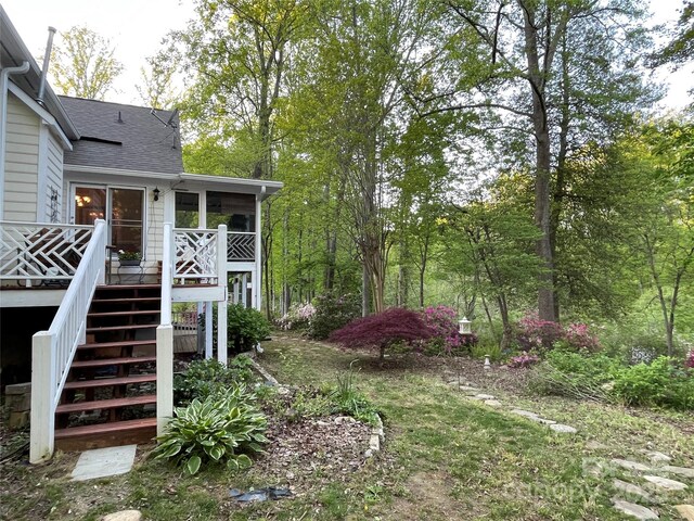 121 General Pemberton St, Stanley, NC 28164 - view of yard featuring a sunroom, a deck, and stairway