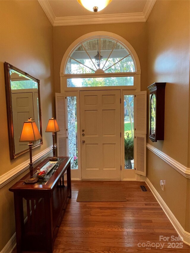 121 General Pemberton St, Stanley, NC 28164 - foyer entrance with ornamental molding, visible vents, baseboards, and wood finished floors