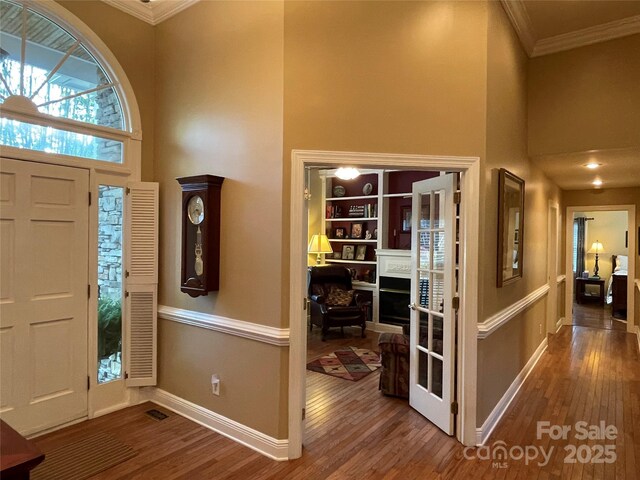 121 General Pemberton St, Stanley, NC 28164 - foyer with crown molding, a high ceiling, and wood finished floors