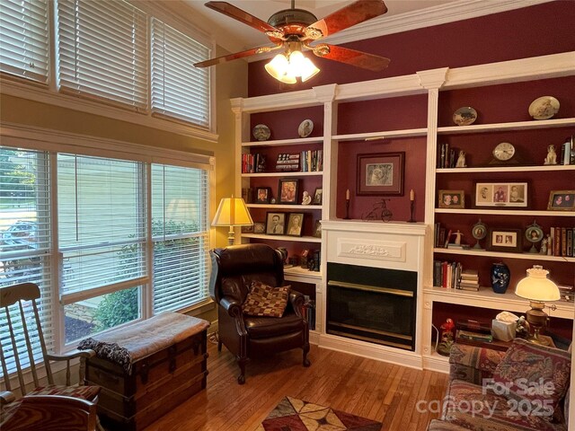 121 General Pemberton St, Stanley, NC 28164 - living area featuring crown molding, wood finished floors, ceiling fan, and plenty of natural light