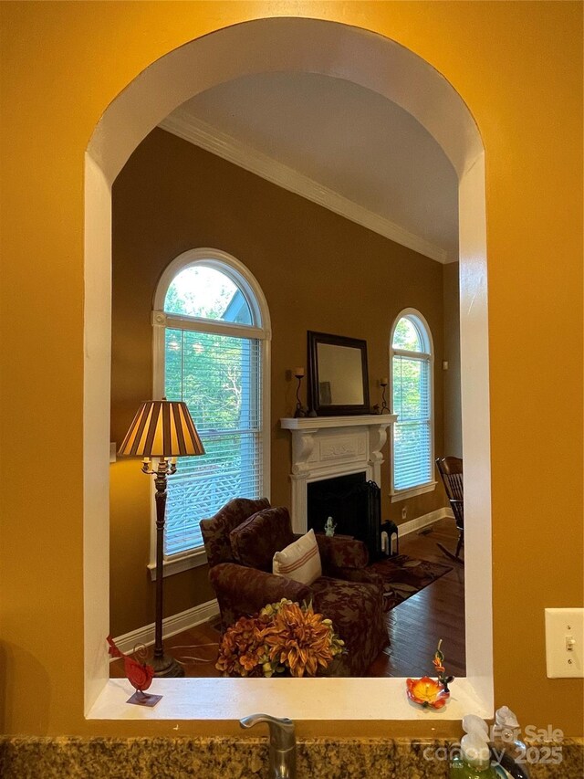 121 General Pemberton St, Stanley, NC 28164 - living room featuring arched walkways, ornamental molding, and a wealth of natural light