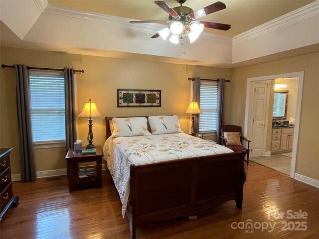 121 General Pemberton St, Stanley, NC 28164 - bedroom with crown molding, ceiling fan, a tray ceiling, wood finished floors, and baseboards