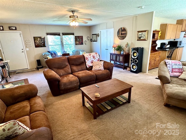2084 Bristol Creek Ave, Morganton, NC 28655 - living area featuring a textured ceiling, light carpet, and ceiling fan