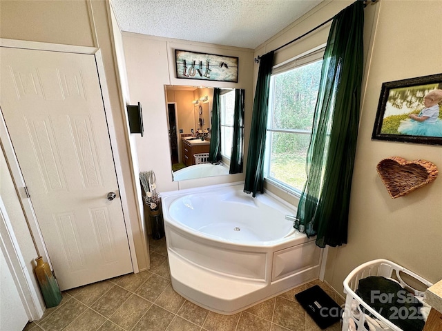 2084 Bristol Creek Ave, Morganton, NC 28655 - full bath with a textured ceiling, a wealth of natural light, tile patterned floors, and a bath