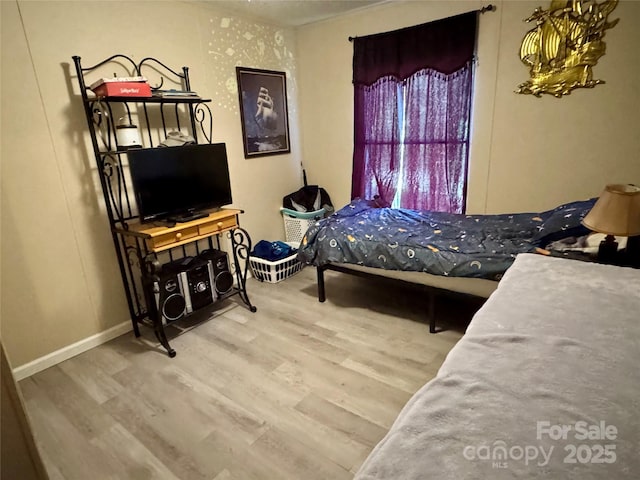2084 Bristol Creek Ave, Morganton, NC 28655 - bedroom with baseboards and wood finished floors