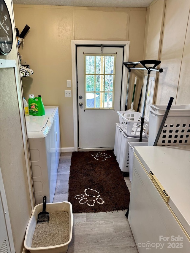 2084 Bristol Creek Ave, Morganton, NC 28655 - washroom featuring laundry area, washing machine and dryer, and light wood-type flooring