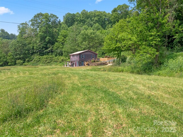 1767 N 226th Hwy, Bakersville, NC 28705 - view of yard with a deck and a forest view