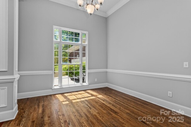 7748 Long Bay Pkwy, Catawba, NC 28609 - empty room with a chandelier, crown molding, wood finished floors, and baseboards