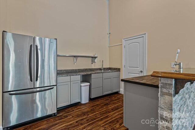 7748 Long Bay Pkwy, Catawba, NC 28609 - kitchen featuring freestanding refrigerator, open shelves, a sink, dark wood-style flooring, and butcher block counters