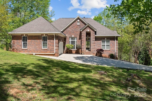 7748 Long Bay Pkwy, Catawba, NC 28609 - view of front of house featuring brick siding, a front yard, and a garage
