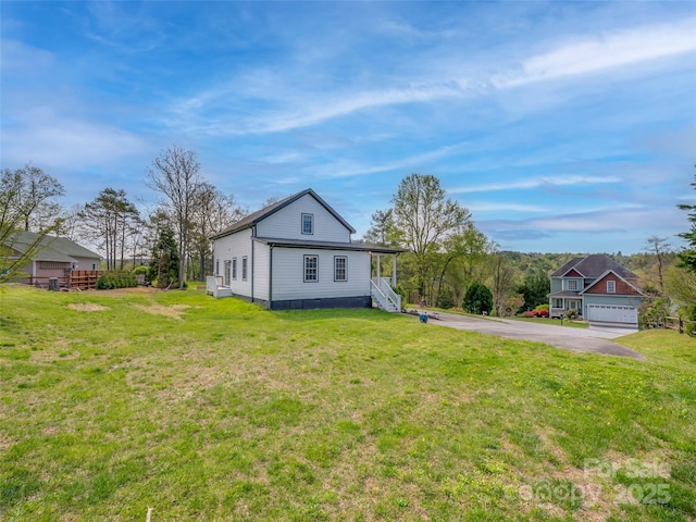 back of property featuring a yard