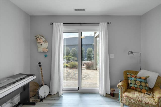 entryway featuring wood finished floors and visible vents
