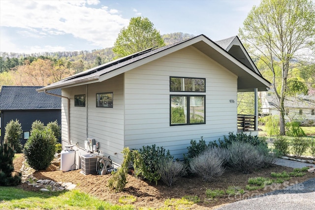 view of property exterior with central AC unit